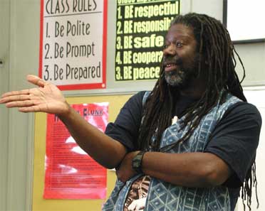Micheal D. McCarty Storyteller speaking to a High-school about the Art of Storytelling and Literacy.